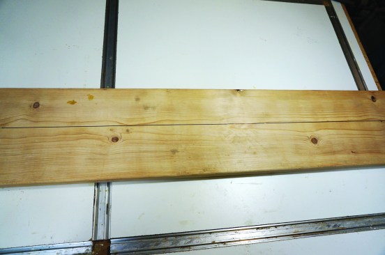 Use it to scribe a line down the board at that distance.