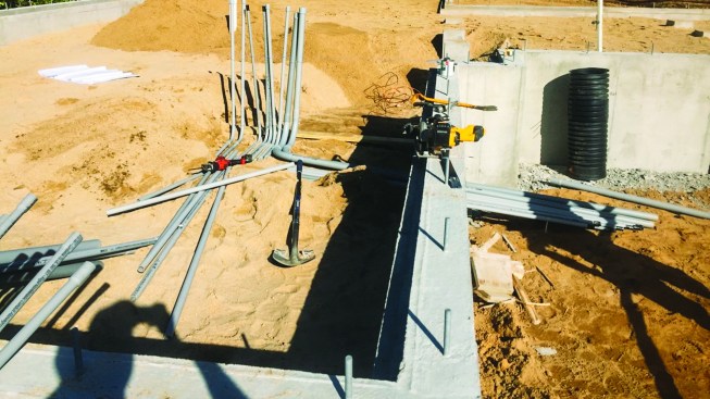 As this was a slab-on-grade system, all of the utilities and services had to be in place before the slab was poured.