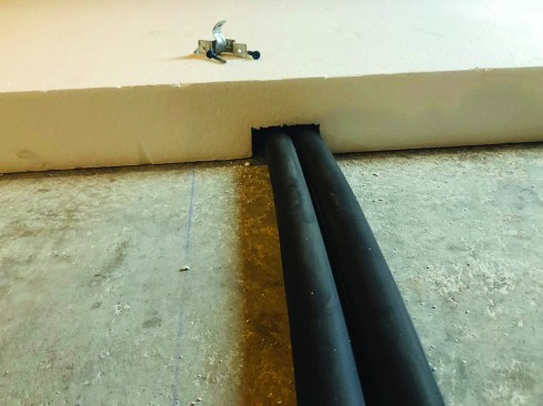 In a few places, the crew notched out the insulation to reposition some of the services.