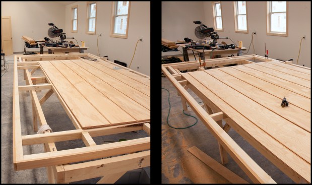 The large doors were 6-foot wide by approximately 11-foot-10-inch high and 3-inches thick (a 2-inch-thick rigid polyiso core with 3/8-inch AC plywood and 5/8-inch T1-11 plywood siding “skins”). Combining the 2-foot transom window and the exterior-facing 8-foot T1-11 heights, the author distributed the balance of the 11-foot-10-inch height in red cedar trim above and below the transom window and at the base of the door. Here, the full-size 4x8 T1-11 panel is attached to the grid using Loctite PL premium adhesive and stainless trim-head screws (photo, left), then the foot-wide add-on panel (photo, right). The vertical shiplap joint between the two panels was fully glued as well, to seal it.