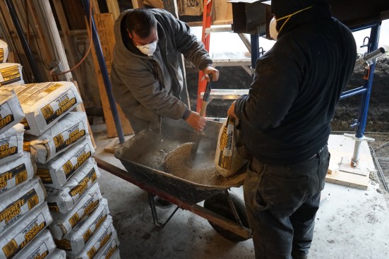 With limited space and limited exterior access, the crew had to mix all the concrete by hand. 