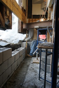 Masons built the foundation walls out of Dry Block CMUs (which are made from water-repellent concrete). 