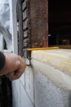 The crew used the same tool and same grout to fill in the gap from the outside.