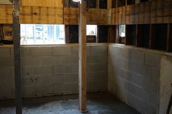 After allowing the grout to cure, the crew removed the needle beams, leaving the corner of the house fully supported by the new foundation and sills. 