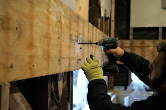 Finally the crew was able to remove the LVLs that had offered temporary support while the wall was being rebuilt.