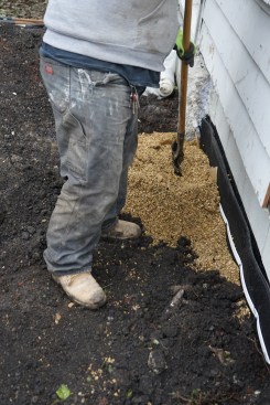 The crew backfilled with pea gravel outside the mat to provide additional drainage.