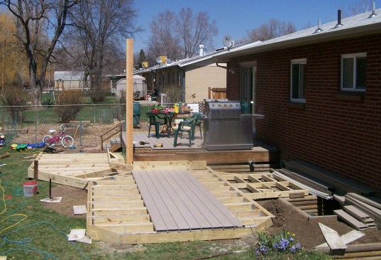 A grade-level deck doesn’t need to be supported by a concrete foundation, as long as the deck is not connected to the house framing.