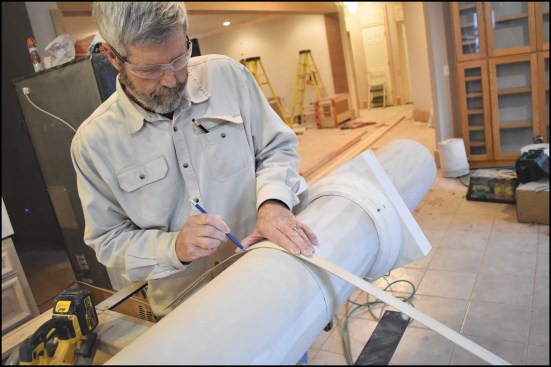 The author used a flexible wood batten to mark the cut lines on the round columns (above).