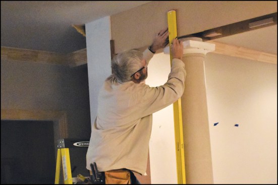 To help ensure that the tapered columns were installed plumb, he used a spirit level to align the centerlines that he marked on the columns’ capitals and bases.