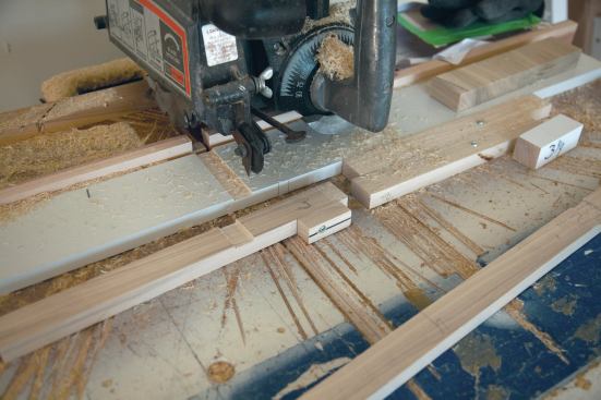 Repeating the process using removable spacers held against the fixed stops located the two cuts needed to plow the second half-lap. (Also see photo 13.)
