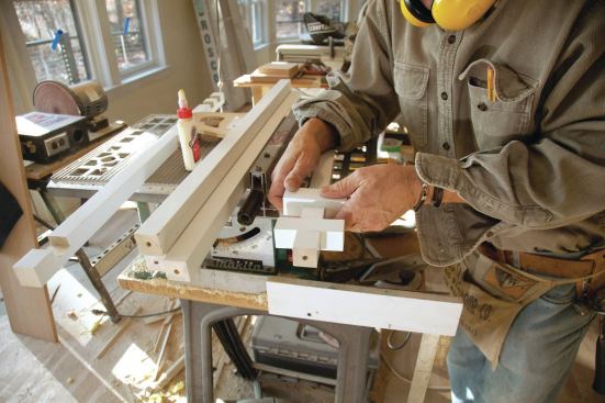 To assemble the three-piece balusters into single units, the two cross blocks were first glued into the center baluster. 