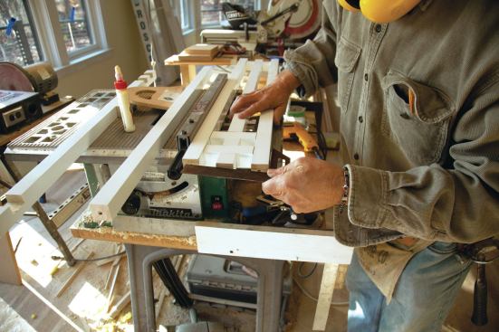 Next, the two outside balusters were positioned alongside using temporary spacers at the other end to keep them parallel. 