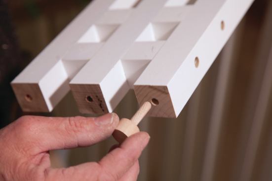 The balusters came predrilled to accept wood pins that anchor them on the tread. 