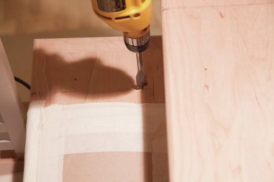 To ensure accurate layout, the author marked the baluster centerline, and drilled the 3/4-inch hole nearest the riser first. 