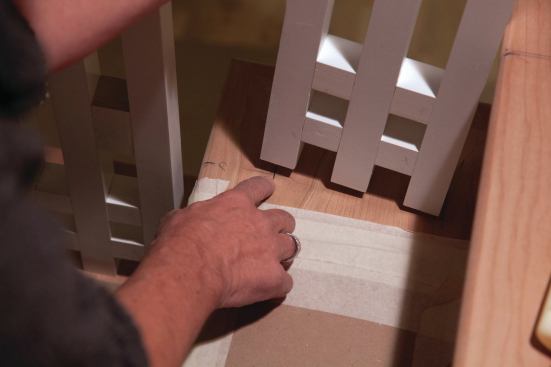 Next, the location of the front hole was scribed using a pencil stub placed into the baluster pin hole to mark an arc across the centerline as the baluster assembly was rotated around the dry-fitted tread pin. No pins were used on the middle balusters.