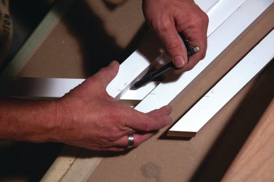 The location of the angled cross-blocks was scribed, and after the pieces were cut, they were glued in place; screws and brads were used at the outer and inner connections, respectively. (Also see photo 23.)