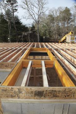Once all of the joists are cut, we frame in the stair openings with LVL.