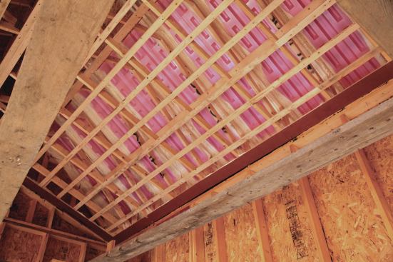 Strapping is installed in the same plane as the OSB strips before the drywall is installed.