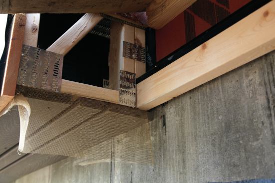 Bronze screen on the bottom of the trusses keeps out the critters, and spaces between the decking boards allow moisture to drain out.