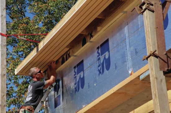 Strips of Alaskan yellow cedar attach to the roof truss tails over bronze screen to create soffit ventilation.