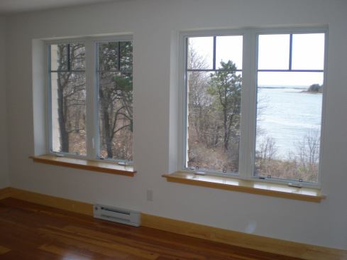 When a window is placed in the center of a thick wall, special attention needs to be paid to drainage on the outside.