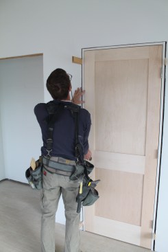 Before nailing the top of the strike jamb, make sure the door slab is hitting the stop evenly.