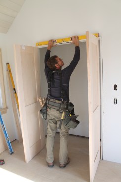 As with the single door, check the head jamb to make sure it's level before proceeding.