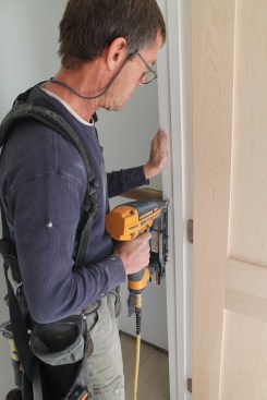 When completely satisfied with the fit, go back and drive nails at each shim point along the sides to secure the assembly in the opening.