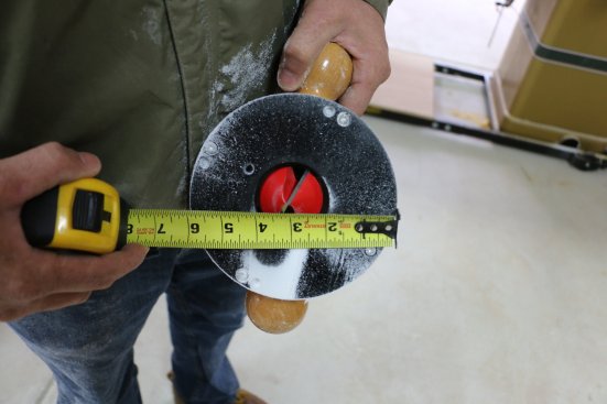 A large V-groove bit is the key to cutting the miter-fold post wraps. To lay out the groves, measure from the center of the bit to the edge of the fence.