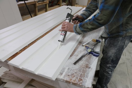 A bead of PVC adhesive is squeezed into the second and third grooves.