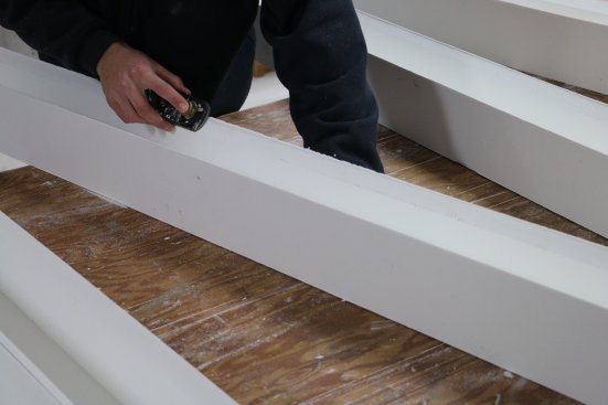 A plane takes the rough corners off that were left by the router.