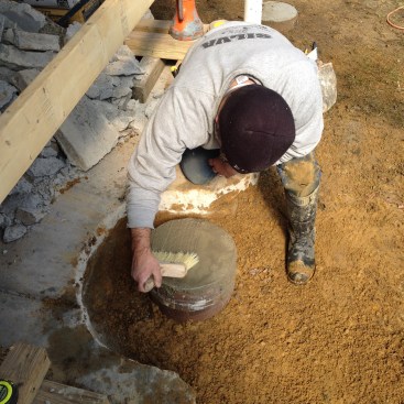When the form was filled, the rest of the hole was backfilled and a broom finish was put on the top of the concrete.