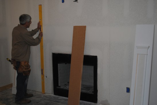 To position the pilasters, the author draws plumb lines beyond the code minimum clearance.