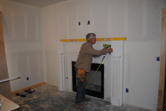 He nails the pilasters to the boards ...