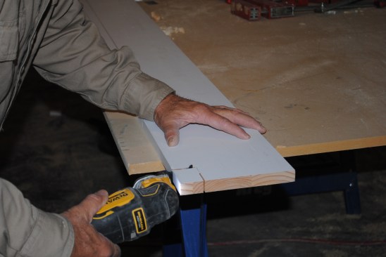 He offsets the lines for the layers of molding. Initial cuts made on a table saw are finished with an oscillating cutter.