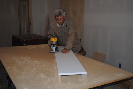 A router with a flush trim bit evens out the edges.