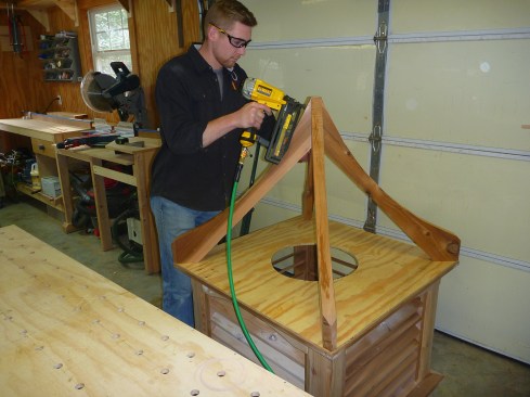 The rafters attach to a plywood platform and meet in the center.