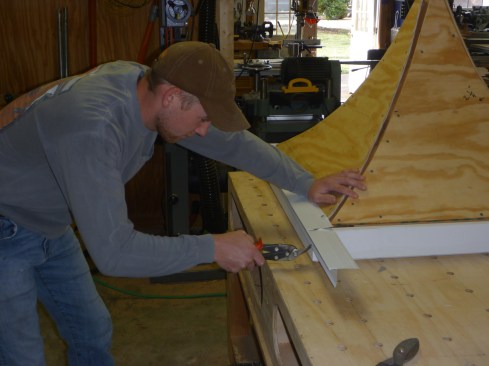After installing the facia around the perimeter of the cupola roof, author begins the roofing with drip edge along the edge of each side.