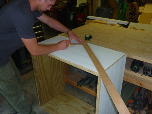 The author built the cupola base out of  two layers of 3/4-inch exterior plywood. Two strips of thin plywood act as a giant bevel square to transfer the angle of the roof to the base