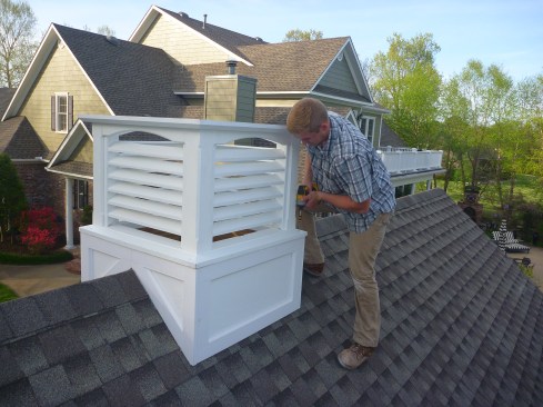 After receiving three coats of exterior paint, the louvered section screws to the base at each corner.