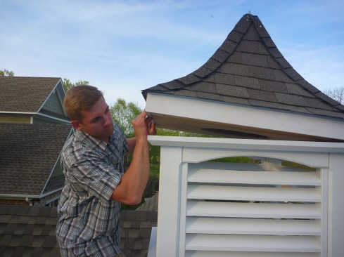 The swooped roof section tops off the assembly. Note, before the roof was permanently attached, insect screening was stapled to the inside of the louvered section.