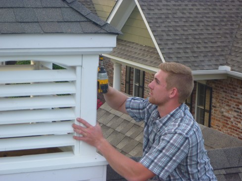 Long screws extend from the frame up into the rafters to secure the roof in place.