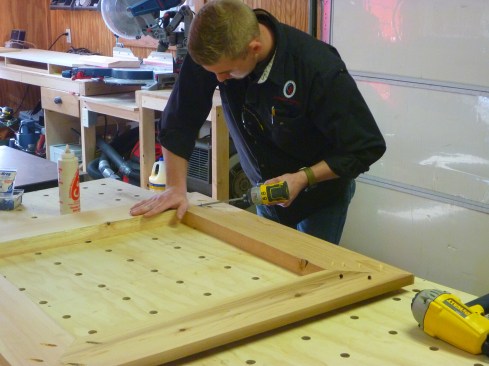 Author assembles the frames on a flat surface, driving pocket screws to secure the corner joints.