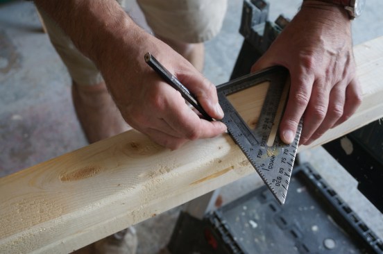 For speed and efficiency stack the top and bottom wall plates and cut them together. After measuring the length, square a line across the top.