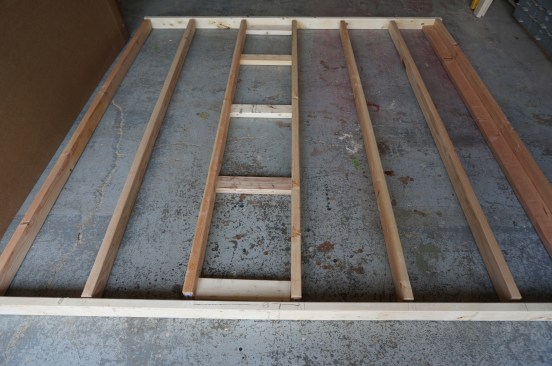 To build the wall, separate the two plates and set studs at each of the layout points. Set the ladder back in place and make sure the rungs are facing the right direction for attaching the intersecting wall.