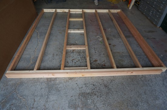 When the wall is assembled add a second top plate. Note that the second top plate steps back the width of the framing to let the top plate from the abutting wall overlap.