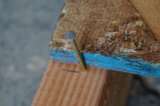 Measure up 48 inches at each end of the wall for the sheathing layout. Tack a nail in above the layout mark to provide the spacing required by the sheathing manufacturer.