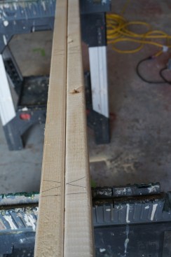 Continue the layout down the length of the plate marking an X on the side of the mark where the stud will be attached.