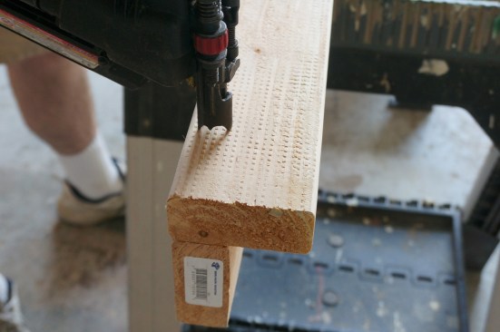 Here the author nails the corner together taking care to drive the nail straight into stud so that it doesn't pop through the edge of the stud below.