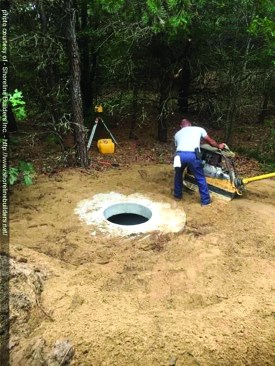 After running the water lines and power supply to the well pit, the excavator backfilled and compacted the soil around the pit.